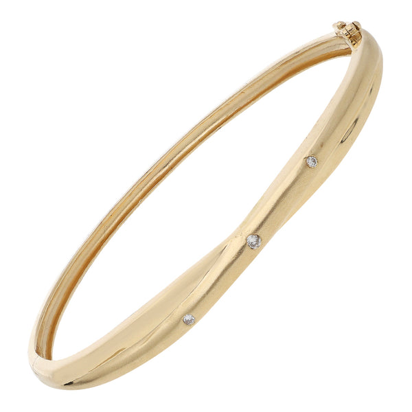 Pulsera de arillo articulada con diamantes en oro amarillo 14 kilates.