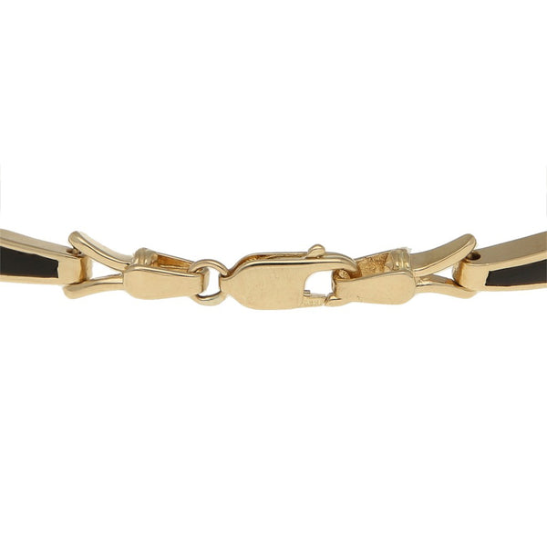 Pulsera eslabón articulado con ónix en oro amarillo 14 kilates.