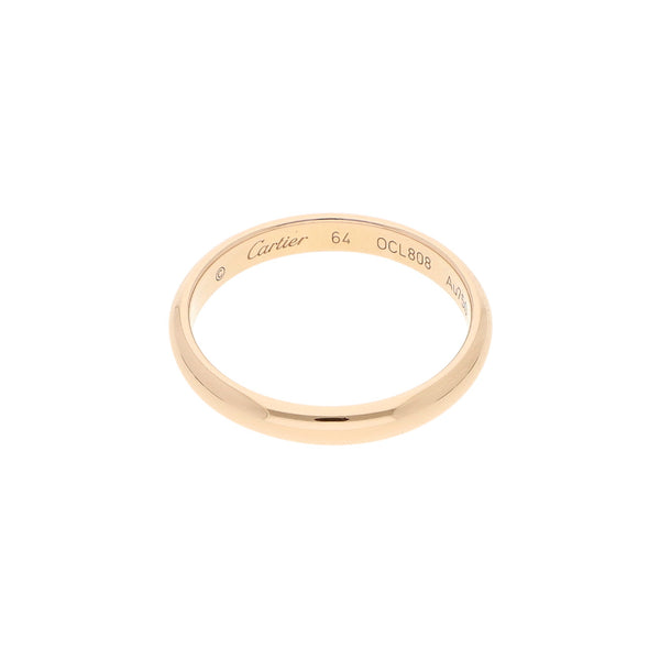 Argolla lisa firma Cartier en oro rosa 18 kilates.