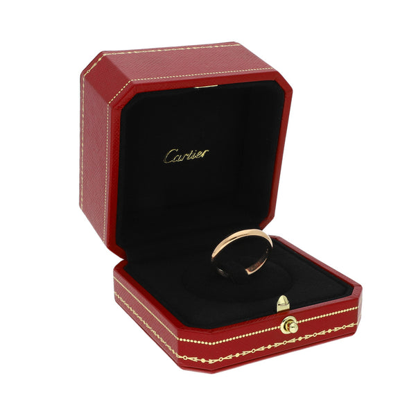 Argolla lisa firma Cartier en oro rosa 18 kilates.