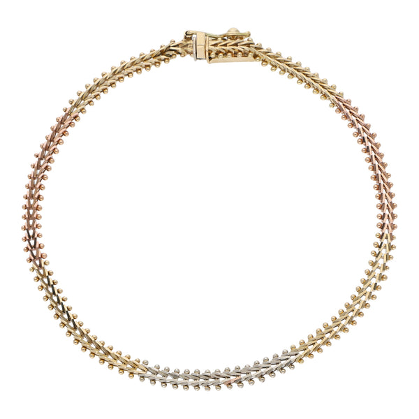Pulsera eslabón boleado en oro tres tonos 14 kilates.