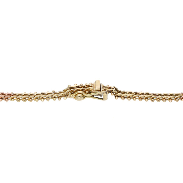 Pulsera eslabón boleado en oro tres tonos 14 kilates.