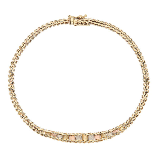 Pulsera eslabón boleado en oro tres tonos 14 kilates.