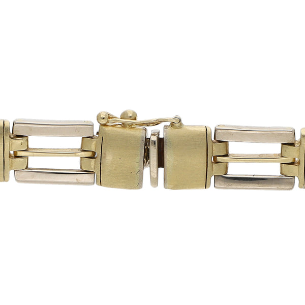 Pulsera eslabón articulado en oro dos tonos 14 kilates.
