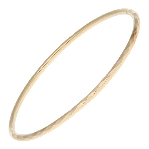Pulsera de arillo facetada en oro amarillo 12 kilates.