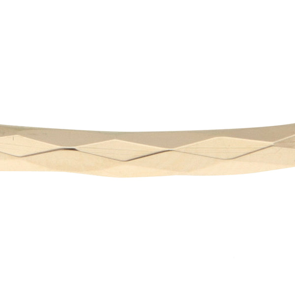 Pulsera de arillo facetada en oro amarillo 12 kilates.