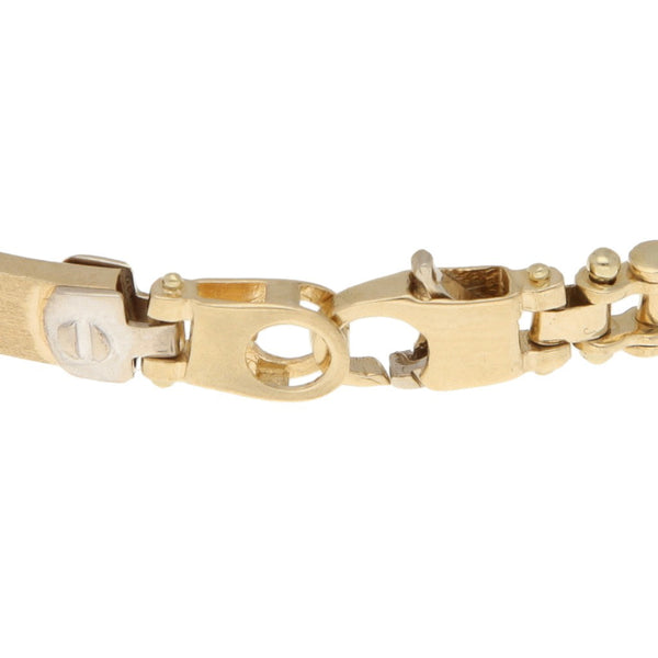 Pulsera eslabón combinado en oro dos tonos 14 kilates.