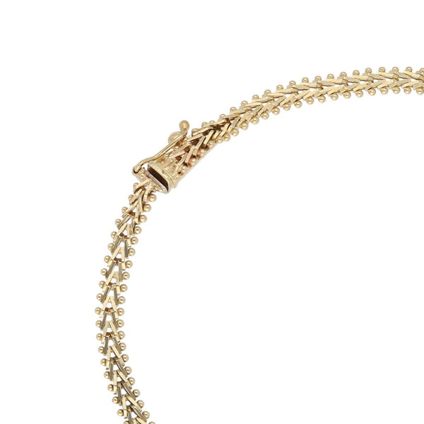 Pulsera eslabón boleado en oro tres tonos 14 kilates.