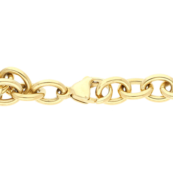 Pulsera eslabón cruzado firma Tiffany & Co. con colgante motivo corazón en oro amarillo 18 kilates.