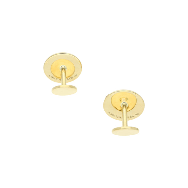 Mancuernillas lisas firma Tiffany & Co. en oro amarillo 18 kilates.
