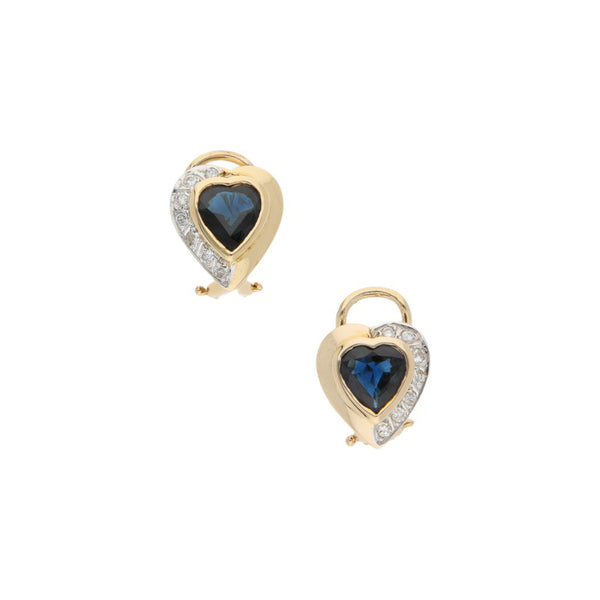 Aretes diseño especial motivo corazón con diamantes y sintético en oro amarillo 12 kilates.