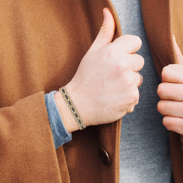 Pulsera eslabón articulado con aplicaciones de cerámica en oro amarillo 14 kilates
