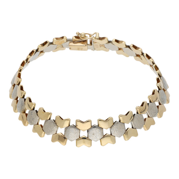 Pulsera eslabón articulado en oro dos tonos 14 kilates.