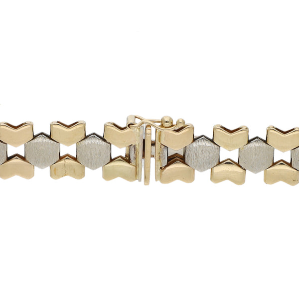 Pulsera eslabón articulado en oro dos tonos 14 kilates.