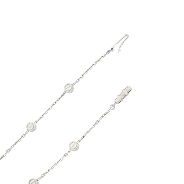 Gargantilla eslabón cruzado firma Cartier con aplicaciones motivo tornillos en oro blanco 18 kilates.
