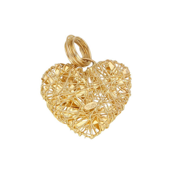 Dije diseño especial motivo corazón en oro amarillo 14 kilates.