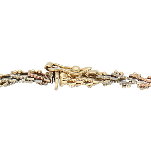 Pulsera eslabón boleado en oro tres tonos 14 kilates.