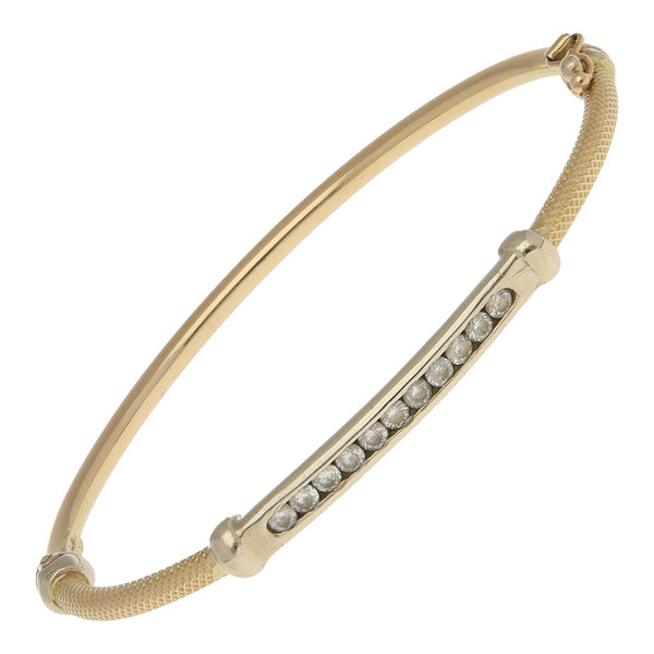 Pulsera de arillo con circonias en oro dos tonos 14 kilates.