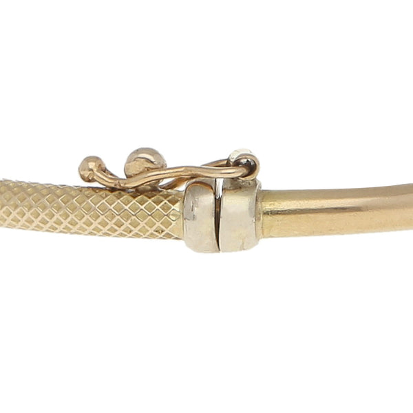 Pulsera de arillo con circonias en oro dos tonos 14 kilates.