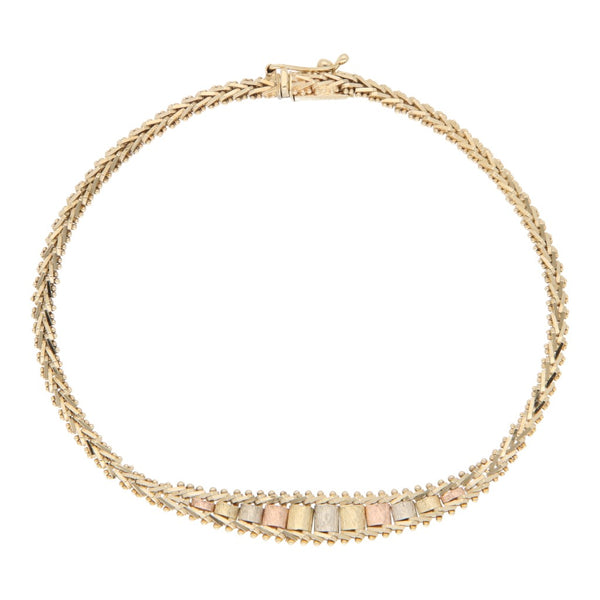 Pulsera eslabón boleado en oro tres tonos 14 kilates.