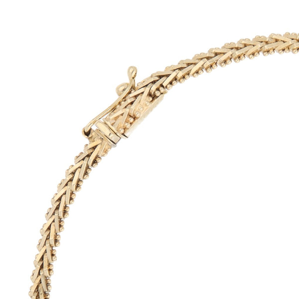 Pulsera eslabón boleado en oro tres tonos 14 kilates.