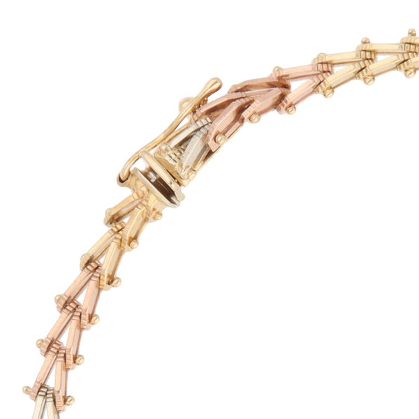 Pulsera eslabón boleado en oro tres tonos 14 kilates.