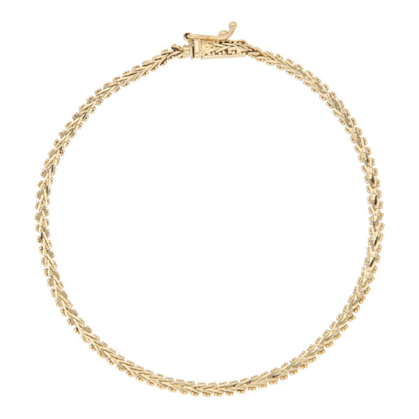Pulsera eslabón boleado en oro amarillo 14 kilates.