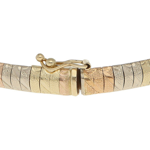 Pulsera eslabón laminado en oro tres tonos 14 kilates.