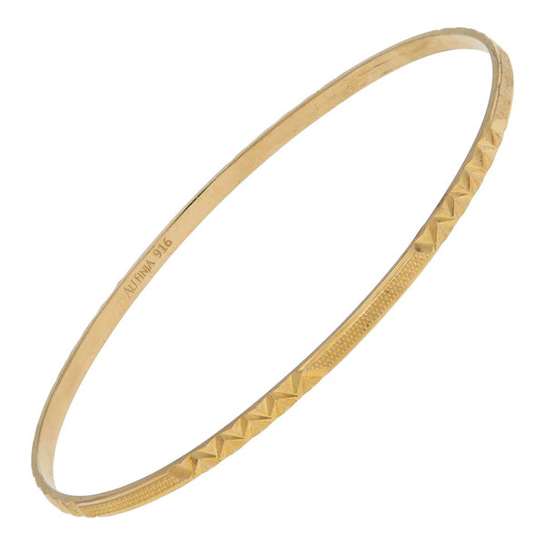 Pulsera de arillo facetada en oro amarillo 22 kilates.