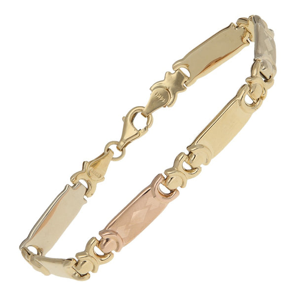 Pulsera eslabón articulado en oro tres tonos 14 kilates.