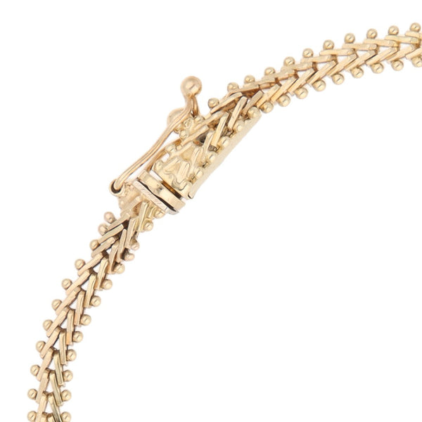 Pulsera eslabón boleado en oro tres tonos 14 kilates.