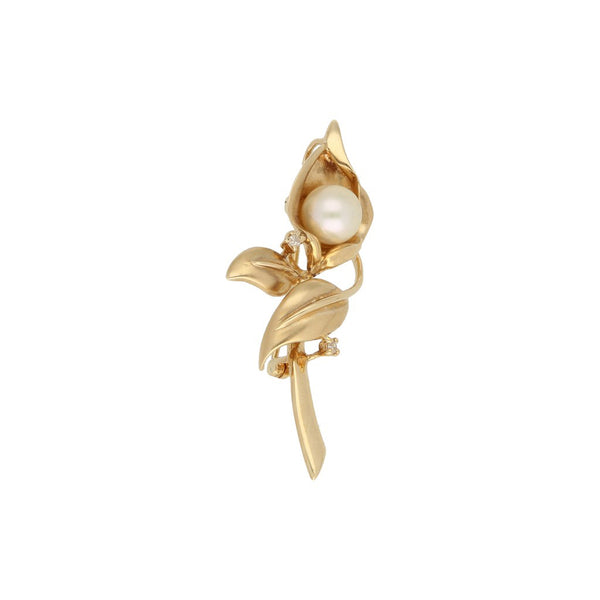 Prendedor diseño especial con diamantes y perlas motivo flor en oro amarillo 14 kilates.
