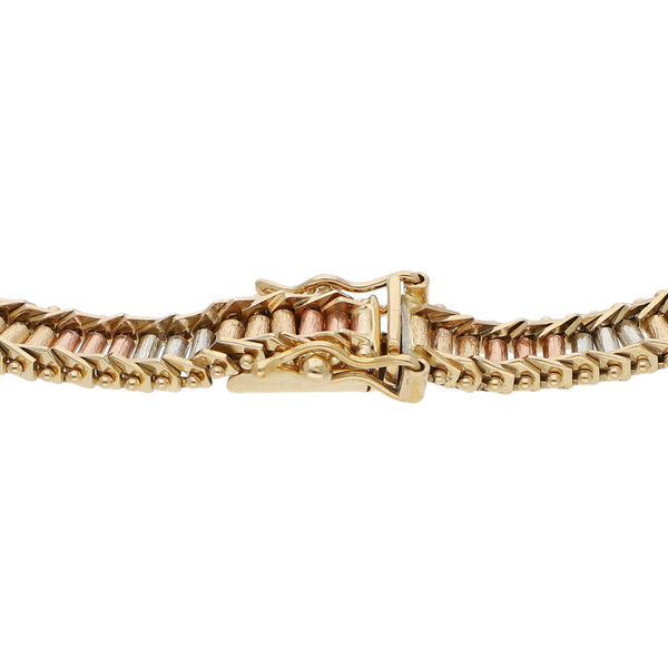 Pulsera eslabón boleado en oro tres tonos 14 kilates.