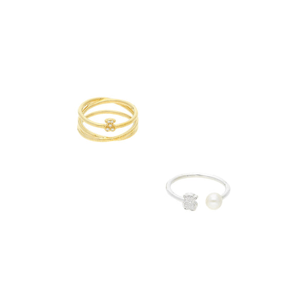 Dos anillos lisos firma Tous con diamantes y perla en oro blanco y amarillo 18 kilates.