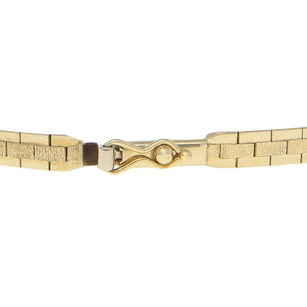 Pulsera eslabón laminado en oro tres tonos 14 kilates.