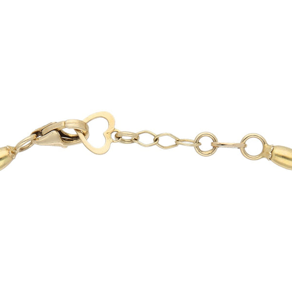 Pulsera de tres hilos eslabón tejido con aplicaciones en oro amarillo 14 kilates.