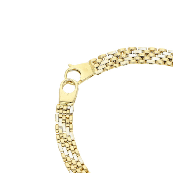 Pulsera eslabón articulado en oro dos tonos 14 kilates.
