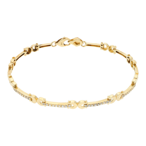 Pulsera eslabón articulado con circonias en oro amarillo 14 kilates.