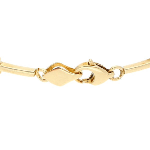 Pulsera eslabón articulado con circonias en oro amarillo 14 kilates.