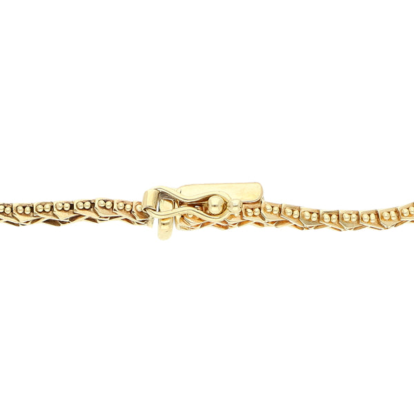 Pulsera eslabón boleado en oro amarillo 12 kilates.
