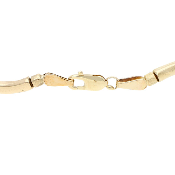 Pulsera eslabón articulado en oro amarillo 14 kilates.