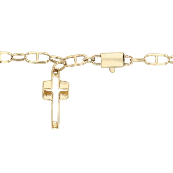 Pulsera eslabón combinado con colgante motivo cruz en oro amarillo 14 kilates.