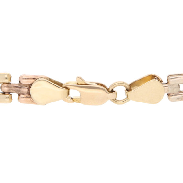 Pulsera eslabón articulado en oro tres tonos 14 kilates.