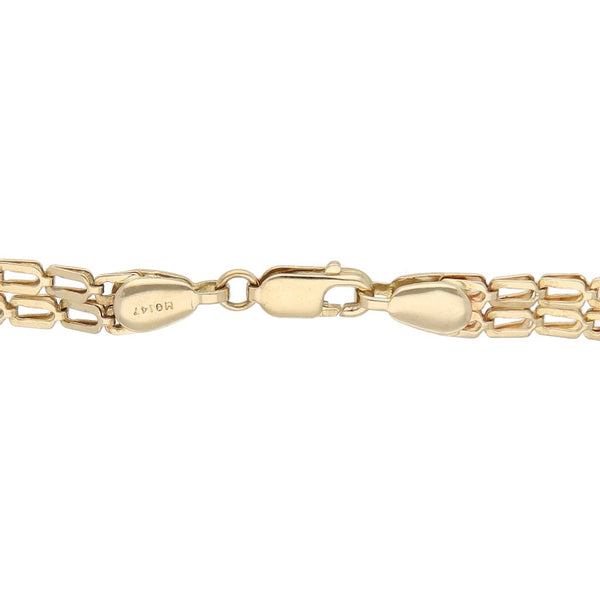 Pulsera de dos hilos eslabón encontrado con aplicaciones figuras diferentes en oro amarillo 14 kilates.