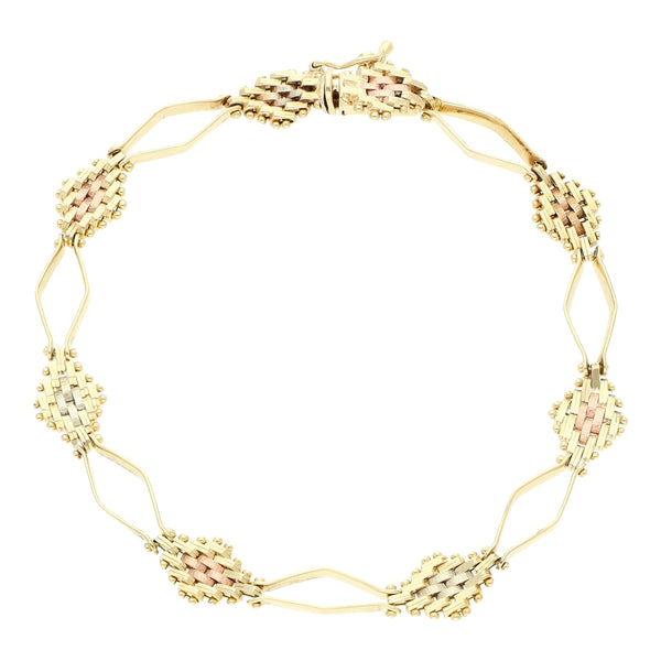 Pulsera eslabón combinado en oro tres tonos 14 kilates.