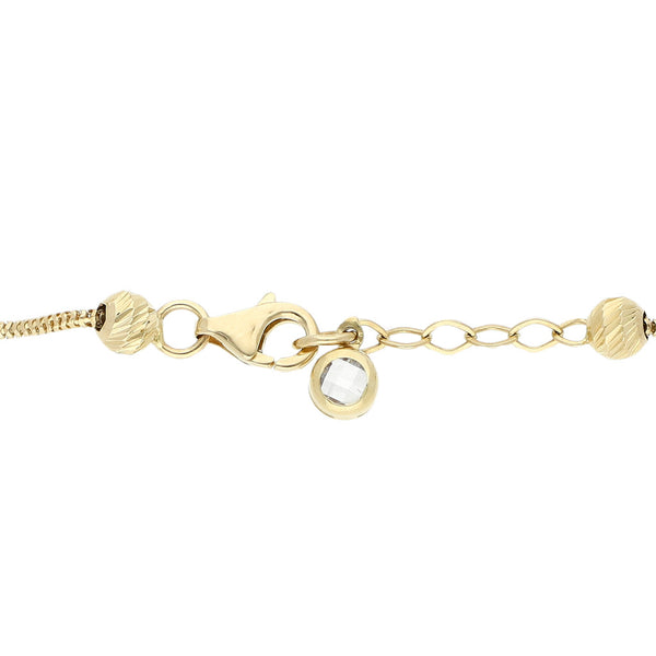 Pulsera eslabón combinado con aplicaciones, sintéticos y colgantes en oro amarillo 14 kilates.