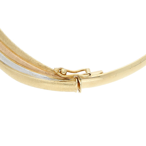 Pulsera de arillo articulada en oro tres tonos 14 kilates.