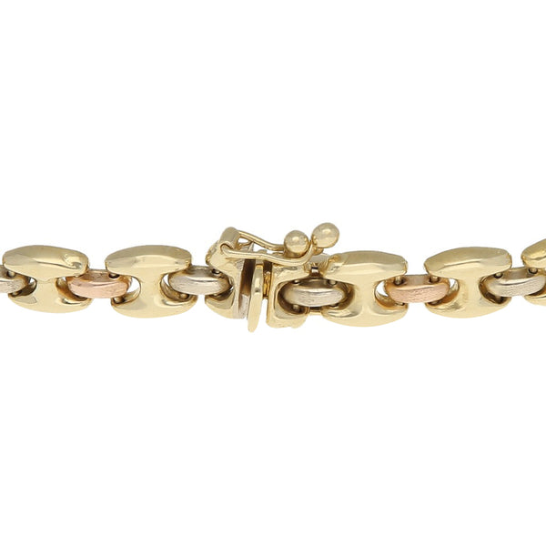 Pulsera eslabón articulado en oro tres tonos 14 kilates.