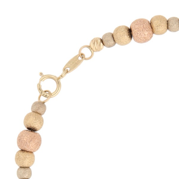 Pulsera eslabón cuadrado cruzado con aplicaciones en oro tres tonos 14 kilates.