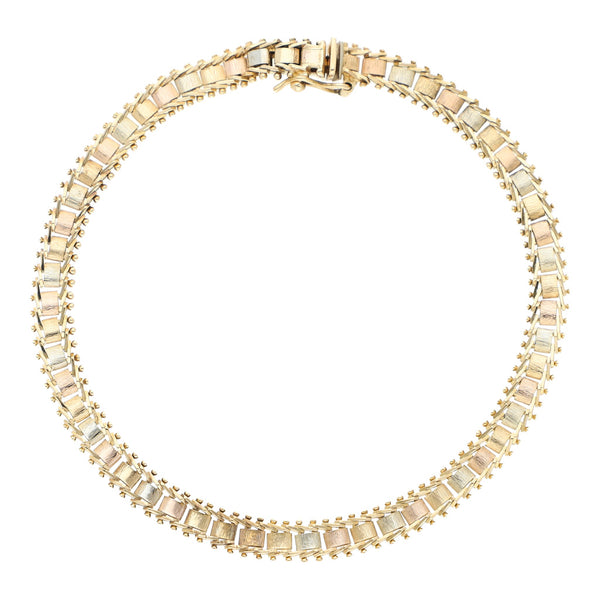 Pulsera eslabón boleado en oro tres tonos 14 kilates.